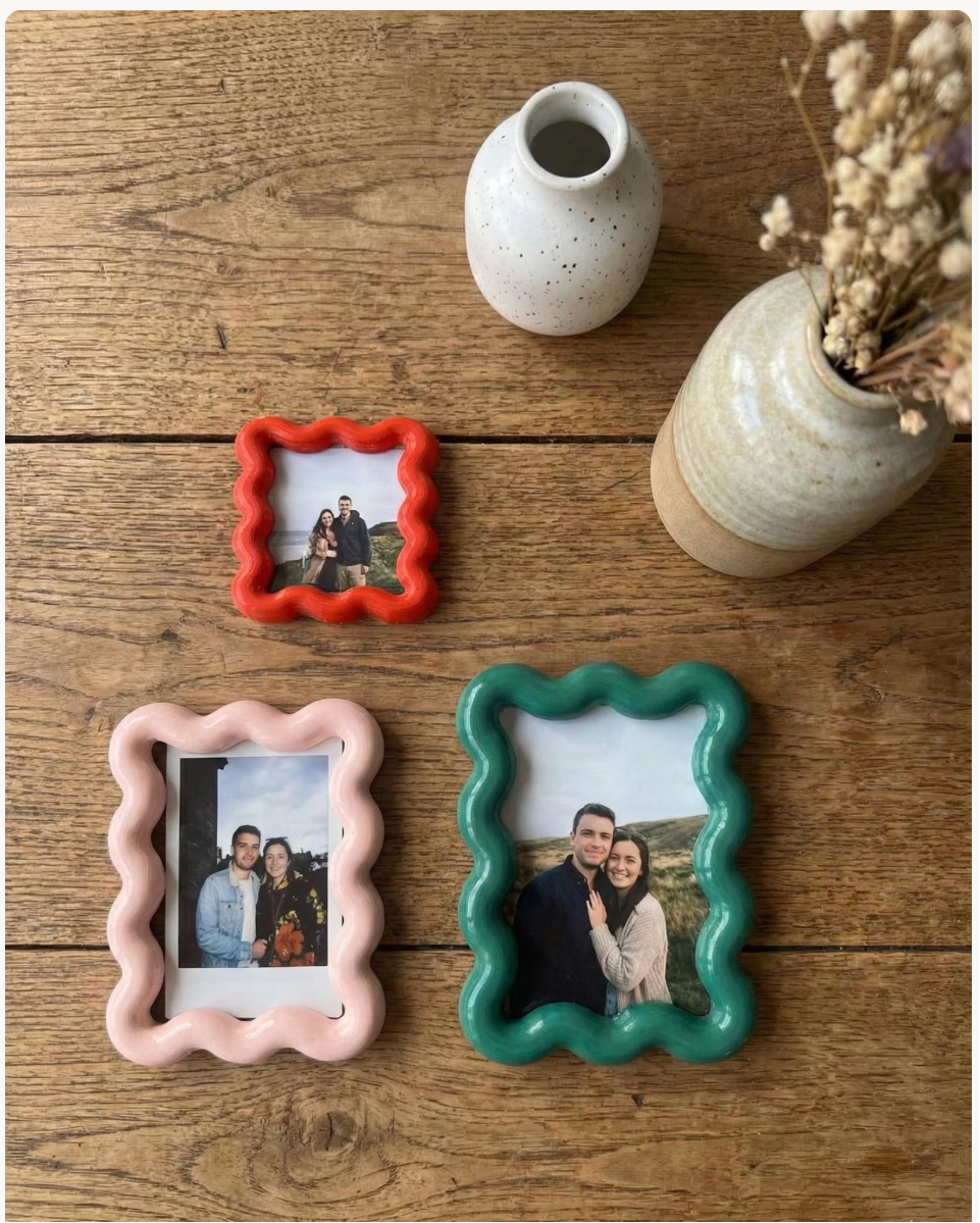 Colorful bold wavy magnetic picture frames displaying photos