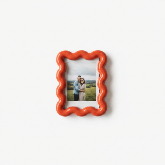 Red bold wavy magnetic picture frame on a clean background