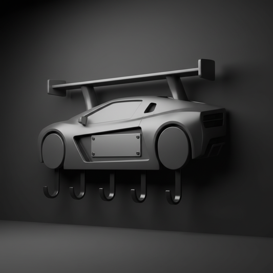 Generic sports-car-inspired wall key rack with a blank name plate in a dark studio setting