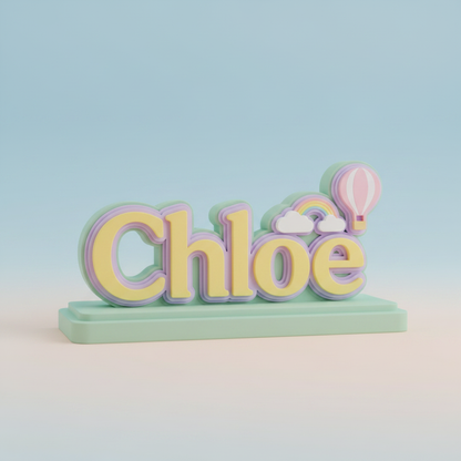Close-up of layered lettering and decorative details on a colorful nursery name sign