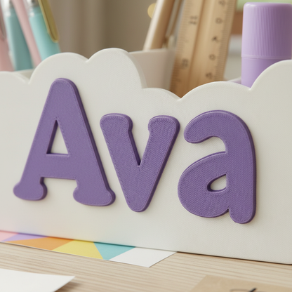 Close-up of raised name lettering and printed texture on a desk organizer